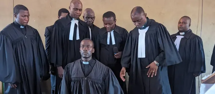 Picture of Pastors Praying for Pastotr Eric During Ordination